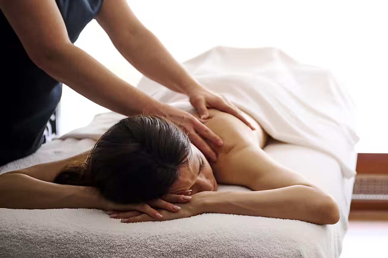 Woman enjoying a massage at the spa